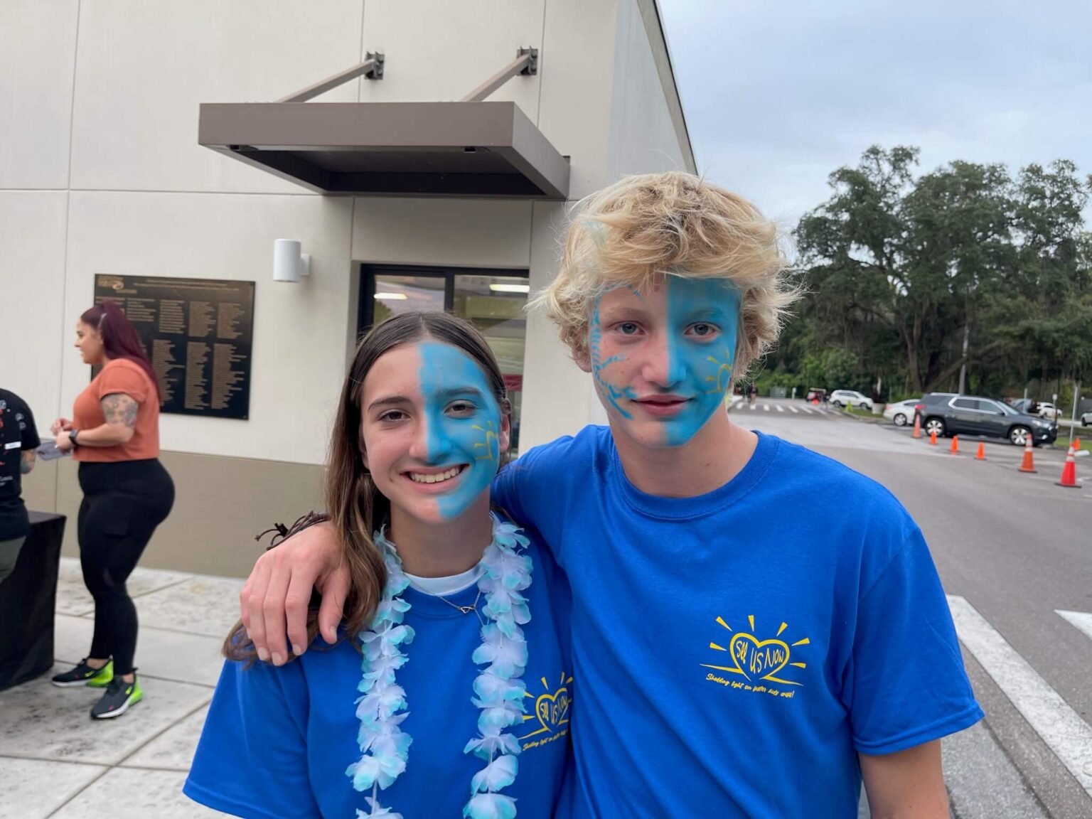 See Us Now supporters gathered together wearing blue